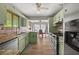 Well-lit kitchen featuring granite countertops, stainless steel appliances, and ample cabinet space at 5016 Comanche Nw Ct, Lilburn, GA 30047