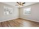 Cozy bedroom featuring wood-look floors, neutral paint and natural light at 5119 Ne Worsham St, Covington, GA 30014