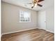 Bedroom features wood floors and a ceiling fan at 5119 Ne Worsham St, Covington, GA 30014