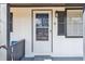 Close-up of the front door with painted doorframe, contrasting shutters, and freshly painted siding at 5119 Ne Worsham St, Covington, GA 30014