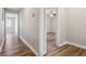 View of hallway that features new flooring and access to bedrooms at 5119 Ne Worsham St, Covington, GA 30014