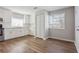 Bright kitchen with white cabinets, wood-look floors and stainless appliances at 5119 Ne Worsham St, Covington, GA 30014