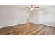 Bright living room featuring wood-look floors, a ceiling fan, and neutral paint at 5119 Ne Worsham St, Covington, GA 30014