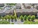 Aerial view of the neighborhood showcasing manicured lawns, townhomes and a community pool at 531 Headwind Way, Alpharetta, GA 30005