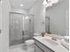 Modern bathroom featuring a glass-enclosed shower and sleek vanity at 531 Headwind Way, Alpharetta, GA 30005