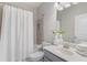 Bright bathroom features a shower, sink, and toilet at 531 Headwind Way, Alpharetta, GA 30005
