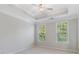 This spacious bedroom features tray ceilings and large windows at 531 Headwind Way, Alpharetta, GA 30005