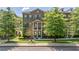 Charming brick townhome featuring a covered entrance and meticulously maintained lawn at 531 Headwind Way, Alpharetta, GA 30005