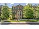 Charming brick townhome featuring a covered entrance and meticulously maintained lawn at 531 Headwind Way, Alpharetta, GA 30005