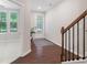 Bright foyer featuring dark hardwood floors and sunlit rooms at 531 Headwind Way, Alpharetta, GA 30005