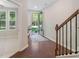 Bright foyer featuring dark hardwood floors and sunlit rooms at 531 Headwind Way, Alpharetta, GA 30005
