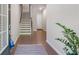 Inviting foyer with gleaming hardwood floors and a staircase at 531 Headwind Way, Alpharetta, GA 30005