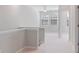 Second-floor hallway with neutral-colored carpet and open floor plan at 531 Headwind Way, Alpharetta, GA 30005