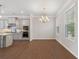 Eat-in kitchen with stainless steel microwave and ovens, and gray cabinets at 531 Headwind Way, Alpharetta, GA 30005