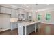 Bright kitchen featuring gray cabinetry, large island and modern lighting at 531 Headwind Way, Alpharetta, GA 30005