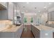 Kitchen featuring gray cabinets and granite countertops with a kitchen island and hardwood floors at 531 Headwind Way, Alpharetta, GA 30005