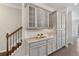 Kitchen pantry with cabinets, drawers, and granite countertop with decor at 531 Headwind Way, Alpharetta, GA 30005
