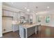 Lovely kitchen boasting stainless appliances, subway tile backsplash, and center island at 531 Headwind Way, Alpharetta, GA 30005
