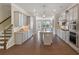 A modern kitchen showcases gray cabinets, granite countertops, stainless steel appliances, and hardwood floors at 531 Headwind Way, Alpharetta, GA 30005