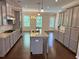 Spacious kitchen with granite countertops, an island, and stainless steel appliances at 531 Headwind Way, Alpharetta, GA 30005