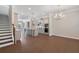 Open-concept eat-in kitchen with stainless steel appliances, gray cabinets, and dark floors at 531 Headwind Way, Alpharetta, GA 30005
