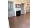 Inviting living room featuring a fireplace and built-in bookshelves at 531 Headwind Way, Alpharetta, GA 30005
