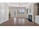Elegant living room with a cozy fireplace and beautiful built-in shelves at 531 Headwind Way, Alpharetta, GA 30005