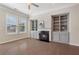 Bright living room featuring a fireplace, built-in shelving, and large windows at 531 Headwind Way, Alpharetta, GA 30005