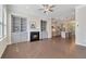Spacious living room open to kitchen featuring fireplace and hardwood flooring at 531 Headwind Way, Alpharetta, GA 30005