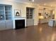 Bright open-concept living space with fireplace, built-in bookshelves, and a spacious kitchen beyond at 531 Headwind Way, Alpharetta, GA 30005