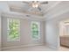 The main bedroom features tray ceilings and an en suite bathroom at 531 Headwind Way, Alpharetta, GA 30005