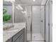 Bright bathroom featuring a glass shower with modern fixtures and neutral tiling at 531 Headwind Way, Alpharetta, GA 30005