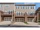 Exterior shot of townhomes with garages and deck space for outdoor living at 531 Headwind Way, Alpharetta, GA 30005