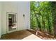 Private back entrance off the patio gives a view of the lush, wooded backyard at 145 Mount Shasta Ln, Johns Creek, GA 30022
