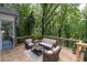 Relax on the deck with outdoor seating and take in the lush, wooded surroundings at 145 Mount Shasta Ln, Johns Creek, GA 30022