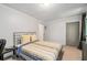 Comfortable bedroom with a bed, side table, and view to the hallway and door, offering a relaxing retreat at 145 Mount Shasta Ln, Johns Creek, GA 30022