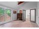 Bedroom with large windows and a closet at 145 Mount Shasta Ln, Johns Creek, GA 30022