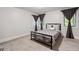 Bright bedroom with large windows and natural light, a comfortable bed, and neutral decor at 145 Mount Shasta Ln, Johns Creek, GA 30022