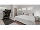 Bright bedroom with natural light, a bed, and a treadmill provides a versatile space at 145 Mount Shasta Ln, Johns Creek, GA 30022