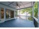 Enjoy the outdoors from the covered porch with ceiling fan and views of the backyard at 145 Mount Shasta Ln, Johns Creek, GA 30022