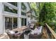 Spacious deck with outdoor seating, sliding glass doors and lots of windows at 145 Mount Shasta Ln, Johns Creek, GA 30022