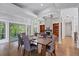 Open concept dining room with tall ceilings, hardwood floors, neutral paint, and lots of natural light at 145 Mount Shasta Ln, Johns Creek, GA 30022