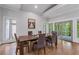 Bright dining room with high ceilings, hardwood floors, neutral paint, and sliding glass doors to backyard at 145 Mount Shasta Ln, Johns Creek, GA 30022