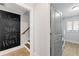 View of stairs, chalkboard and doorway to laundry room with washer and dryer at 145 Mount Shasta Ln, Johns Creek, GA 30022