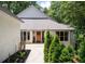 Charming home featuring manicured landscaping and walkway at 145 Mount Shasta Ln, Johns Creek, GA 30022