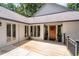 Inviting front porch with stylish railing and front door at 145 Mount Shasta Ln, Johns Creek, GA 30022