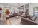 Bright living room boasts hardwood floors, neutral paint, lots of natural light, and an open layout at 145 Mount Shasta Ln, Johns Creek, GA 30022