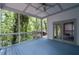 Breezy screened porch with views of lush greenery and access to the outdoor deck at 145 Mount Shasta Ln, Johns Creek, GA 30022