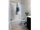 Cozy bathroom with shower-tub combo, toilet, and dark wood vanity at 3235 Chutney Ct, Avondale Estates, GA 30002