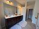 Bright bathroom featuring double sink vanity, and tile flooring at 3235 Chutney Ct, Avondale Estates, GA 30002